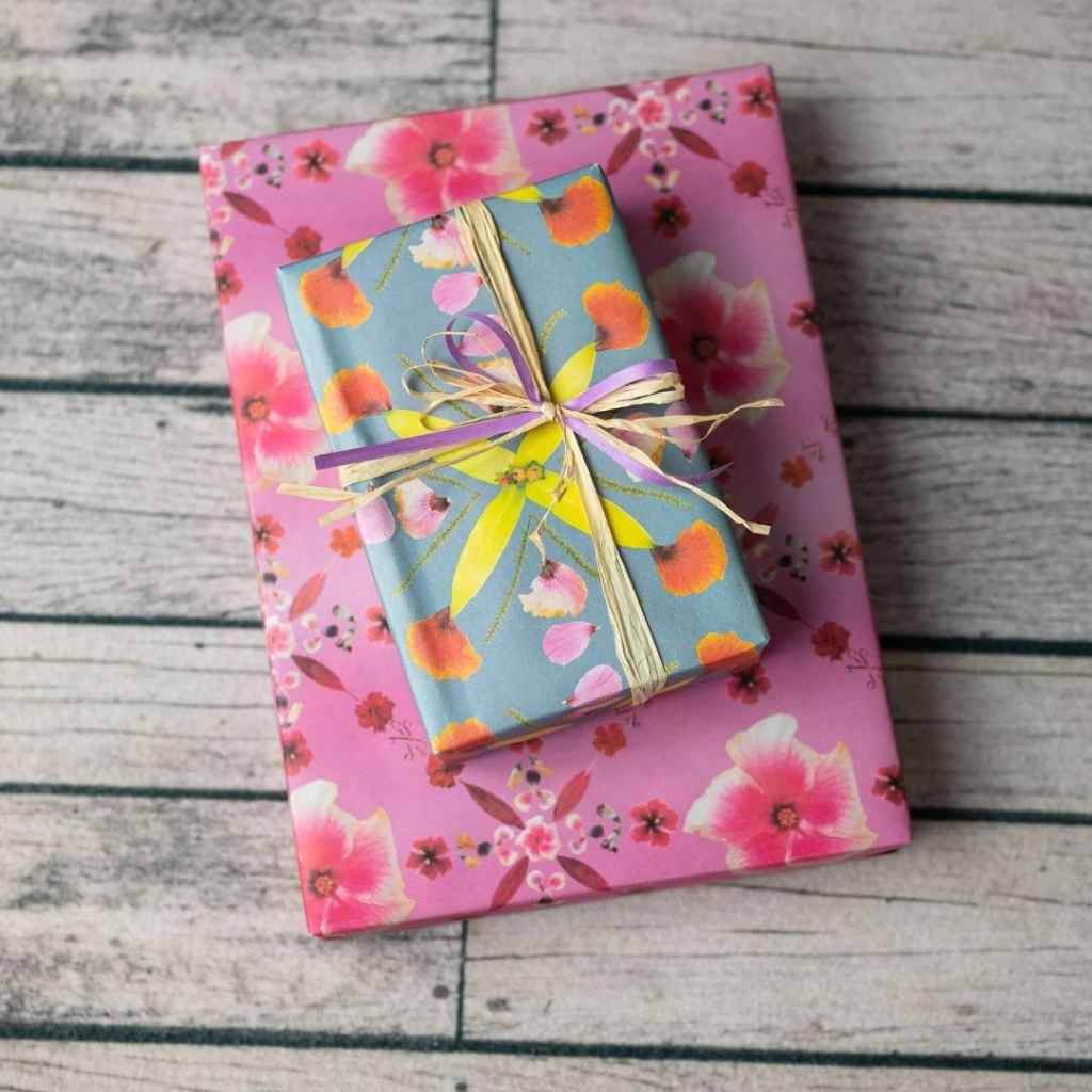 Eco Wrapping Paper by Wrappily - Pink Hibiscus reversible &amp; recyclable gift wrap. Pink with flower petals blue with yellow and orange petals. Made in USA.