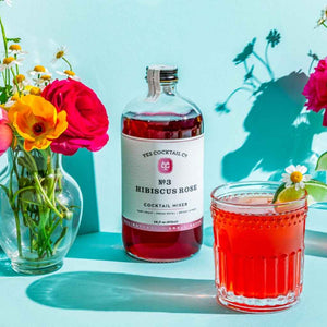Glass bottle of Hibiscus Rose Cocktail Mixer by Yes Cocktail Co. all natural, small batch, handcrafted.