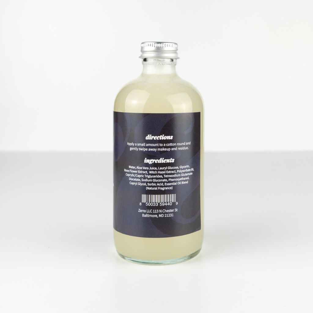 glass bottle with meta cap and black label for Zerra &amp; Co. Makeup Remover 8fl oz, back label with directions and ingredients