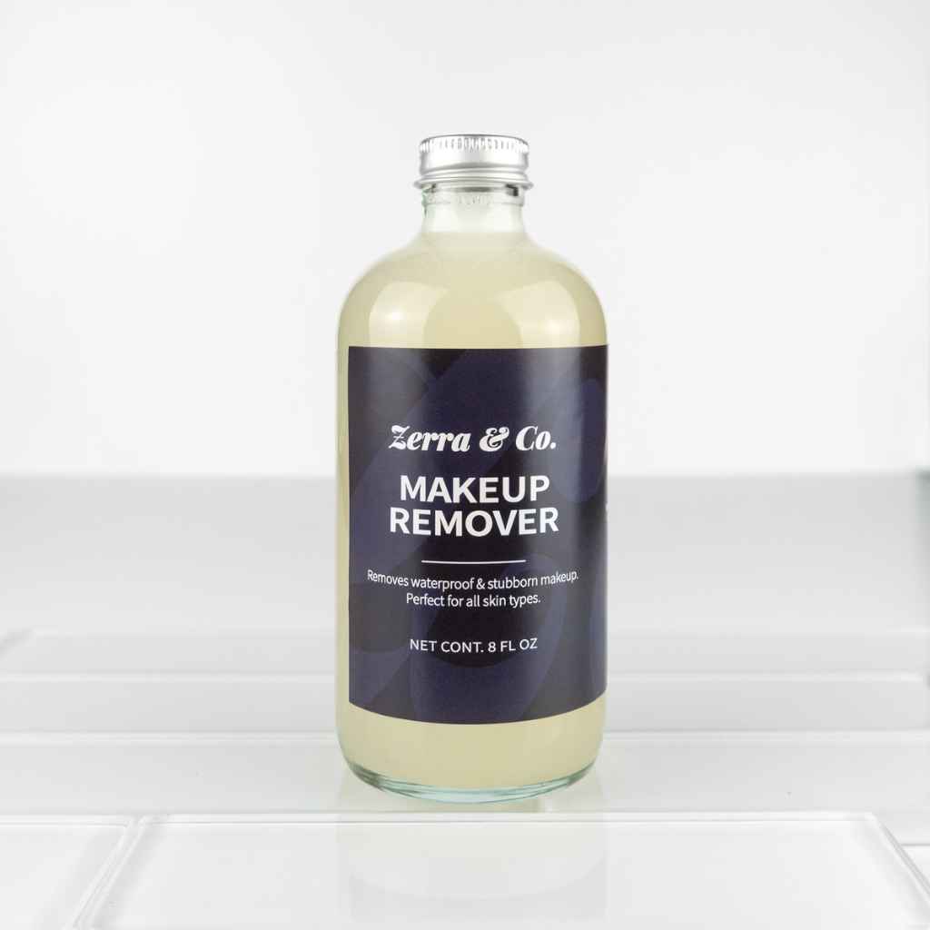 glass bottle with meta cap and black label for Zerra &amp; Co. Makeup Remover 8fl oz
