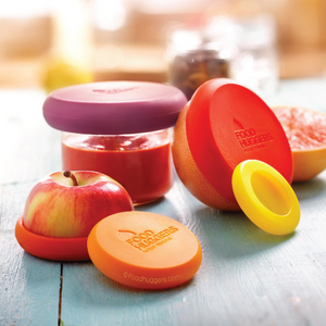 red apple, grapefruit, jar of tomato sauce using multi colored food huggers