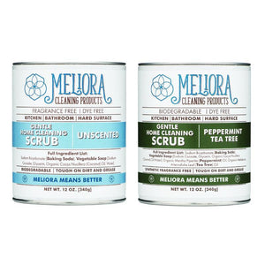 12 oz meliora scrub can, white and blue on left. 12 oz meliora cleaning scrub can, green and white on right