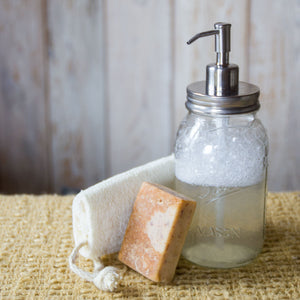 mason jar with clear soap and stainless steel dispenser top