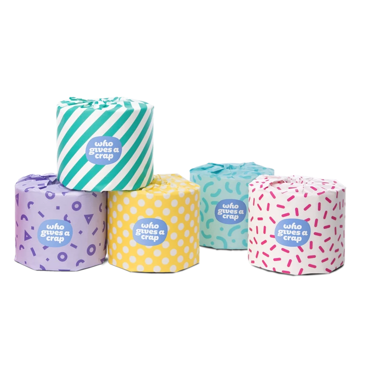 5, 3 ply "who gives a crap" toilet paper rolls, each with a multicolored/multi patterned package design