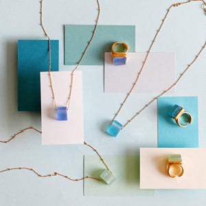 Square recycled glass pendant necklaces and three gold band recycled glass rings (shades of blue)