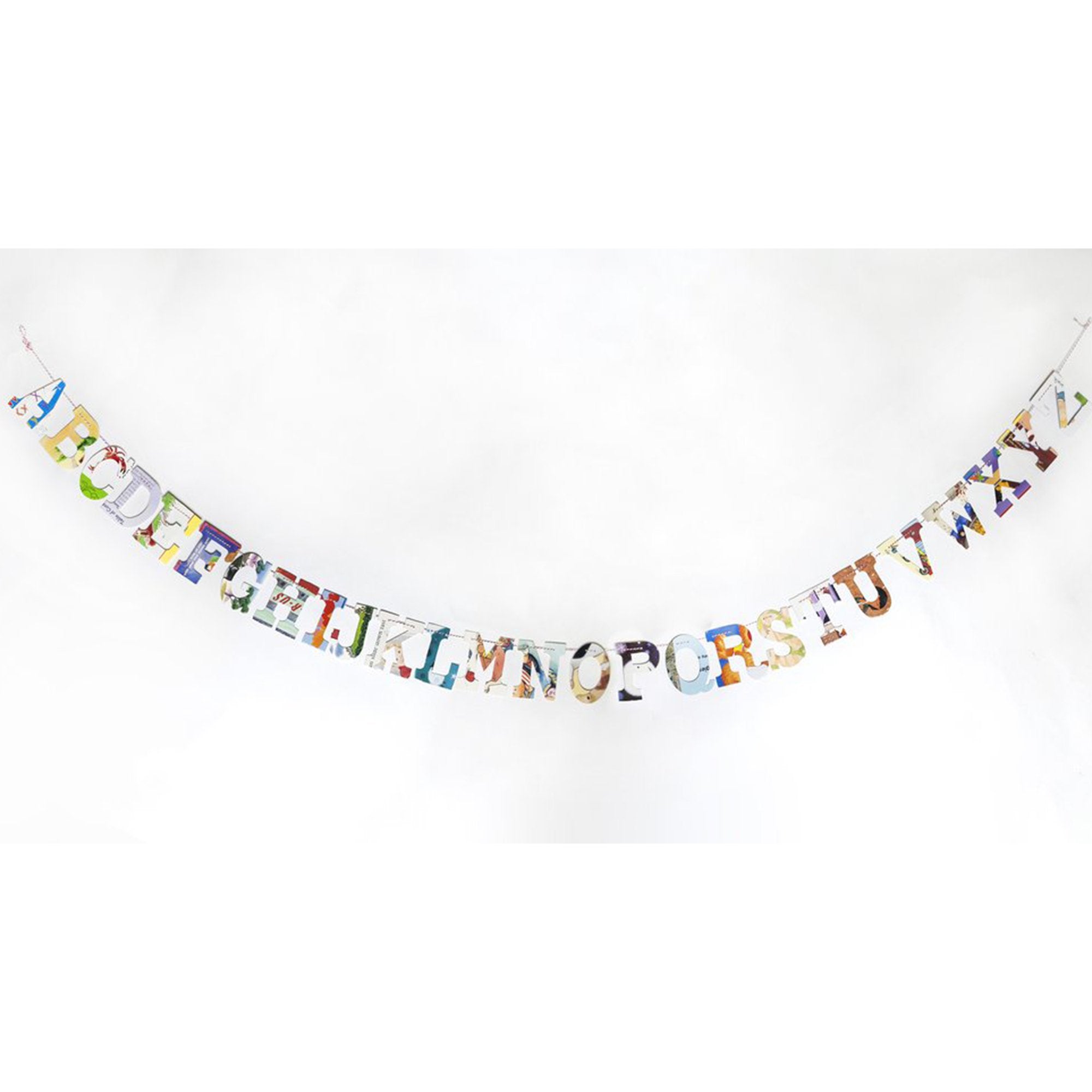 multi-colored, collage style alphabet garland displayed  hanging on white wall