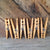 6 clothespins displayed vertically in front of rustic reclaimed wood
