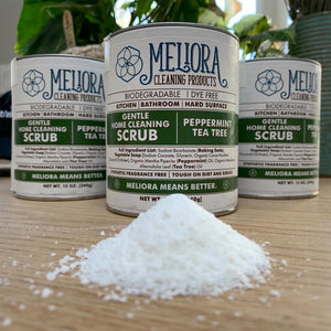 12 oz meliora cleaning scrub cans, peppermint tea tree green, soap shavings in foreground