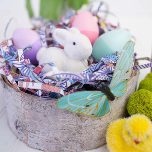 birch bowl filled with easter decor, bunny, chic, butterfly, colored eggs, and eco shred basket filler