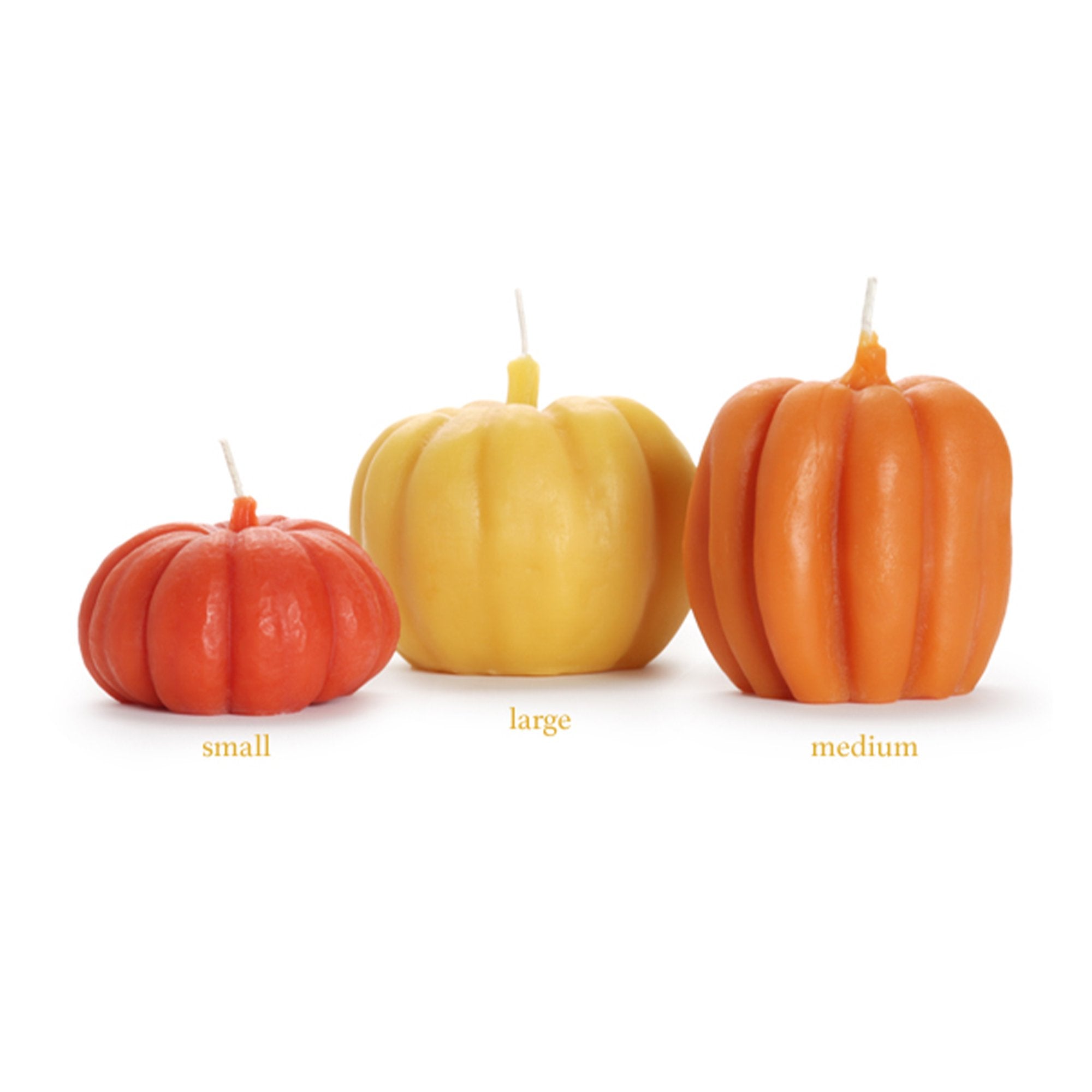 Three pumpkin candles in various sizes, labeled