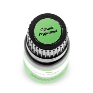 birds eye view of 10 ml black bottle with green label. reads "organic peppermint"