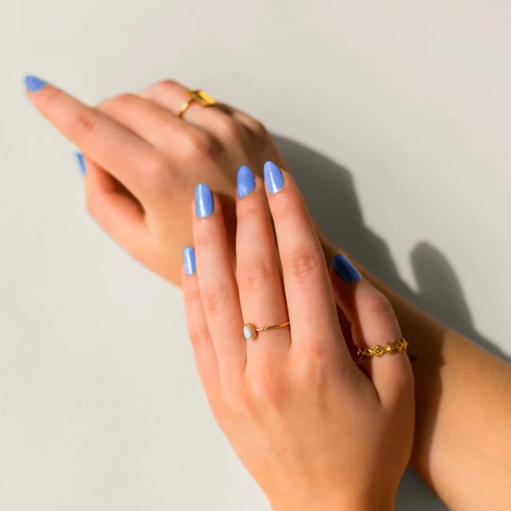 VEGAN, 21-Free, 77% plant-based nail polish, BKIND nail polish in Marco Polo, a shiny cornflower blue color