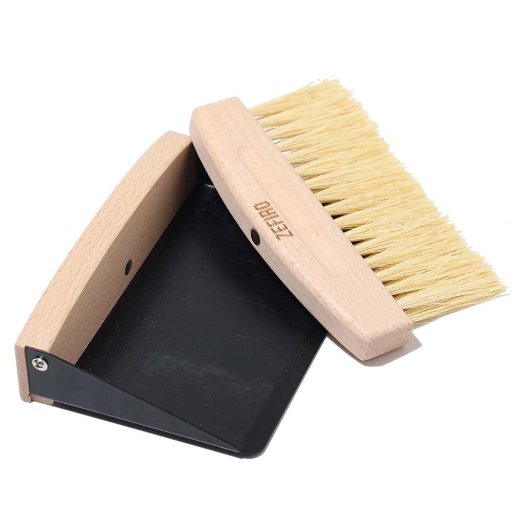 Zefiro mini sweep FSC certified beechwood mini broom with sisal bristles. Thin metal dustpan included. Set snaps together with small inset magnet. Woman owned business. 