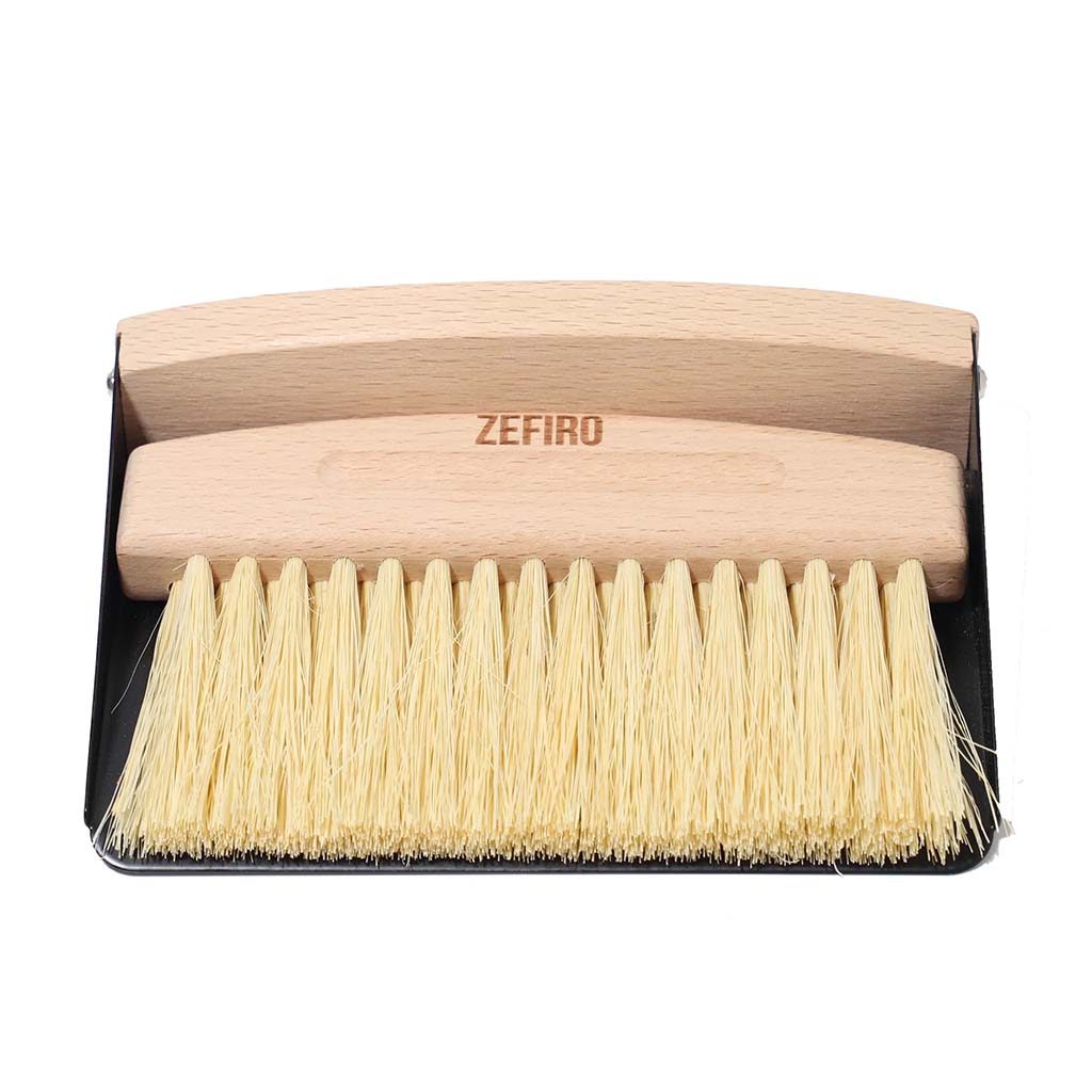 Zefiro mini sweep FSC certified beechwood mini broom with sisal bristles. Thin metal dustpan included. Set snaps together with small inset magnet. Woman owned business. 