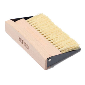 Zefiro mini sweep FSC certified beechwood mini broom with sisal bristles. Thin metal dustpan included. Set snaps together with small inset magnet. Woman owned business. 