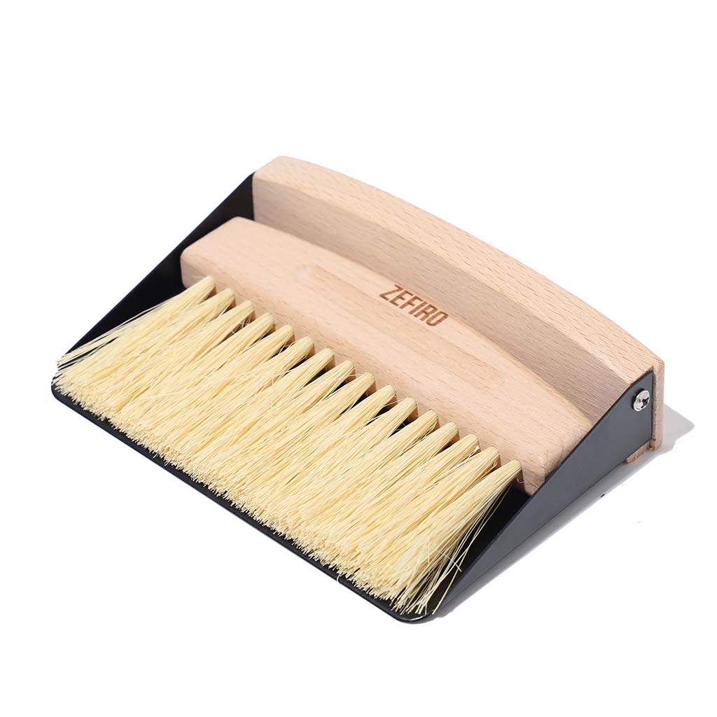 Zefiro mini sweep FSC certified beechwood mini broom with sisal bristles. Thin metal dustpan included. Set snaps together with small inset magnet. Woman owned business. 