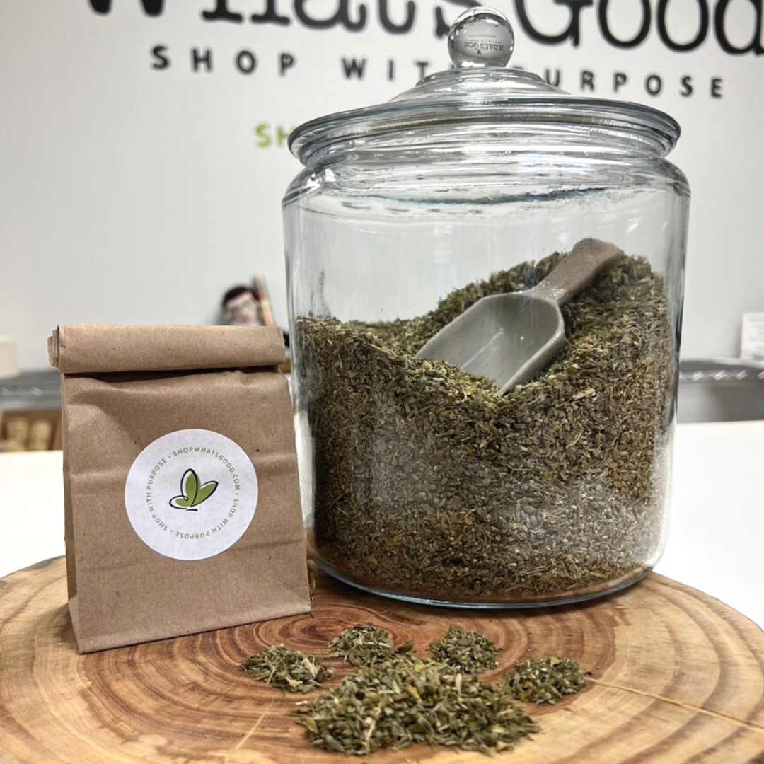 Bulk organic cat nip featured in a glass jar with scoop and brown paper bag.