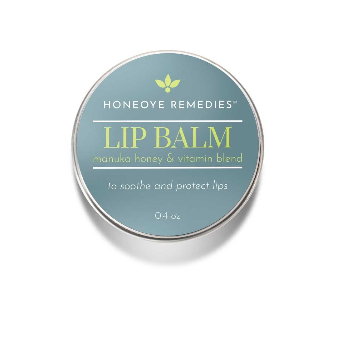 100% natural lip balm made with manuka honey in a .4oz tin on a white background