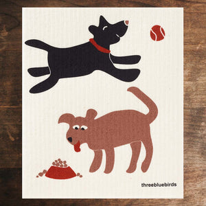 White Swedish Dishcloth with 1 Black Dog, 1 Brown Dog, and Red Ball and Food Dish Front Side Eco-Friendly