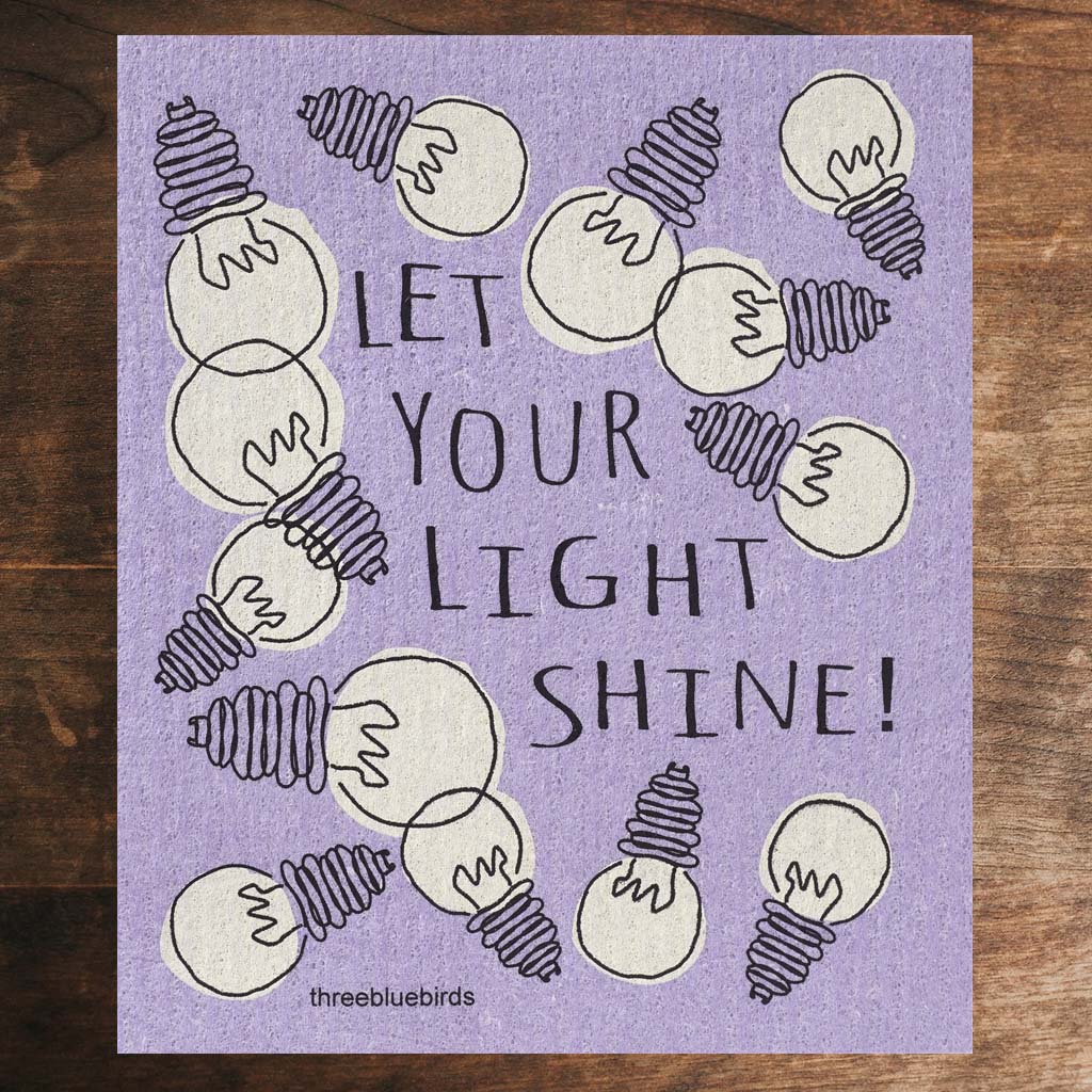 Purple Swedish Dishcloth with white lightbulb pattern and text that reads &quot;Let Your Light Shine!&quot; Front Side Eco-Friendly