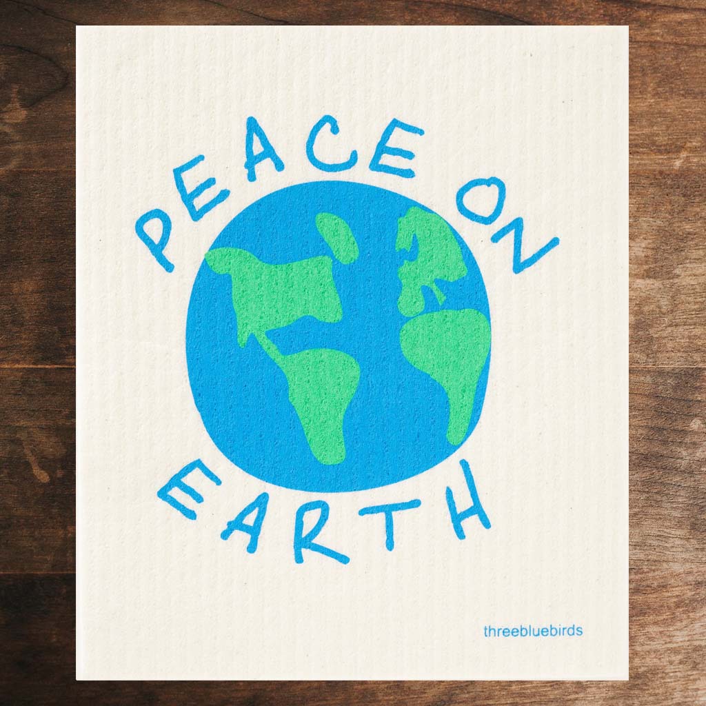 White Swedish Dishcloth with blue and green planet and text that reads &quot;Peace On Earth&quot; Front Side Eco-Friendly